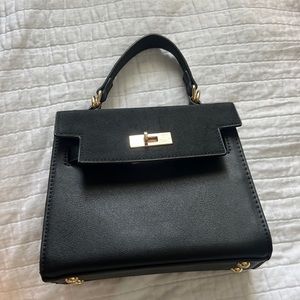 francesca’s black and gold purse